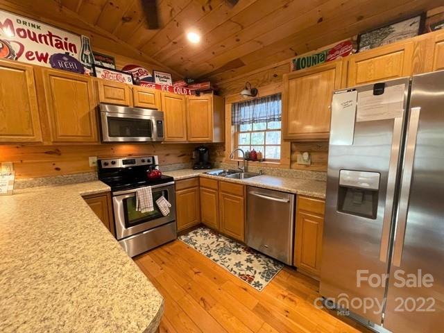 357 Cinnamon Ridge Rutherfordton, NC 28139 - Photo 4 of 40 a kitchen with stainless steel appliances granite countertop a refrigerator a stove top oven a sink and dishwasher