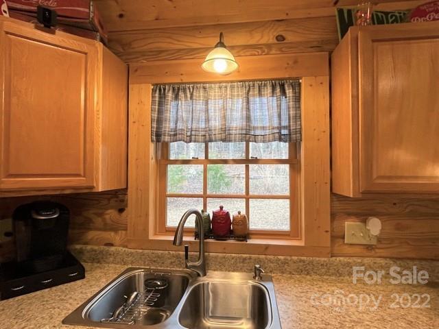 357 Cinnamon Ridge Rutherfordton, NC 28139 - Photo 5 of 40 a kitchen with granite countertop a sink and a window