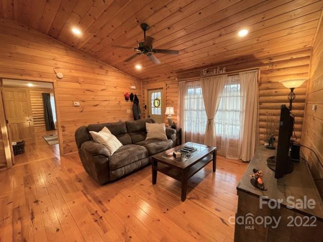 357 Cinnamon Ridge Rutherfordton, NC 28139 - Photo 9 of 40 a living room with furniture a flat screen tv and a large window