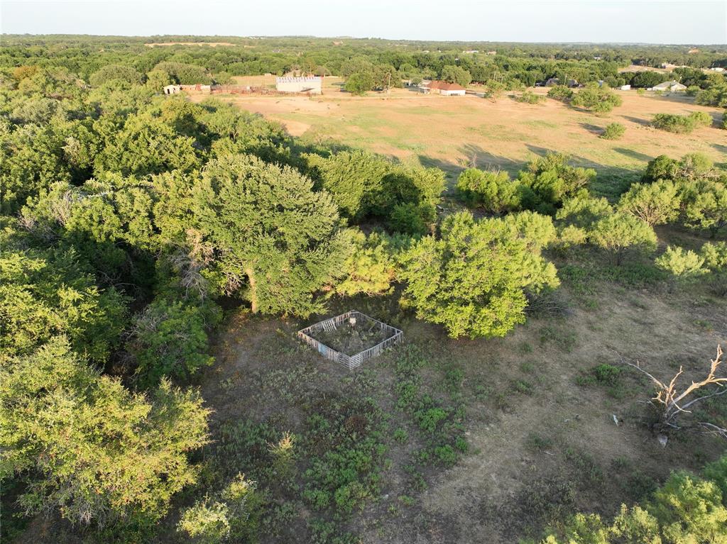 566 Harmony Road Weatherford, TX 76087 - Photo 12 of 14 Aerial view of property and surrounding area featuring a forest