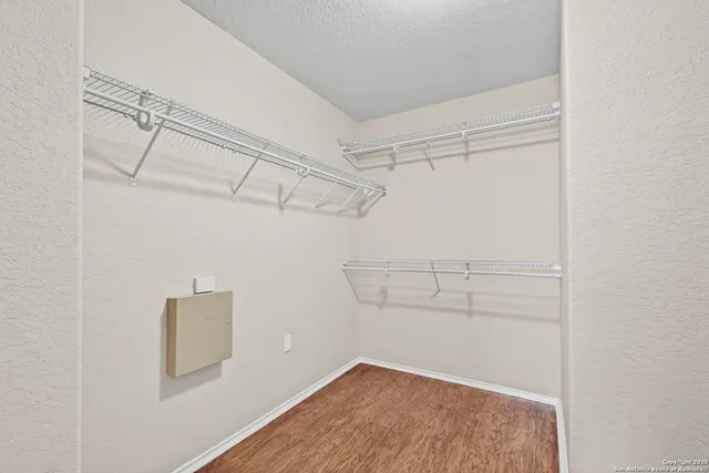 a view of a room with racks on the wall