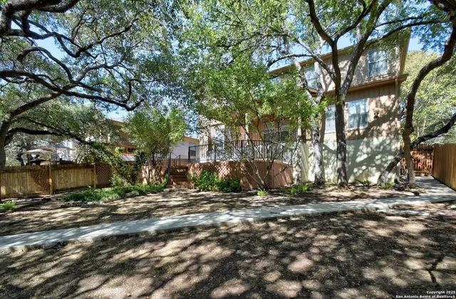 a view of outdoor space with deck and tree