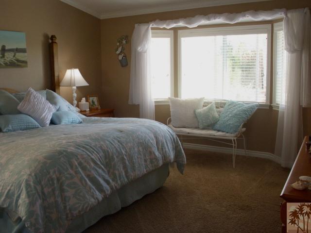 49364 Wayne Street Indio, CA 92201 - Photo 14 of 25 a bed sitting in a bedroom next to a window