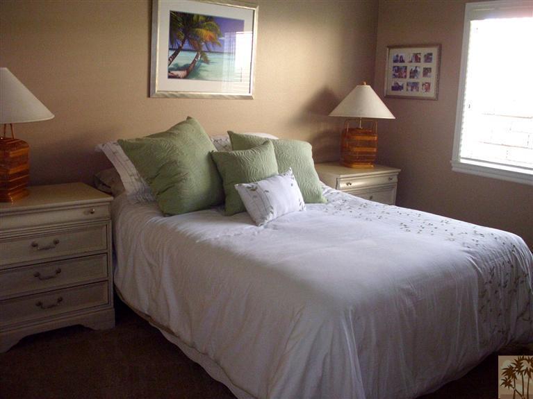 49364 Wayne Street Indio, CA 92201 - Photo 17 of 25 a bedroom with a bed and a window