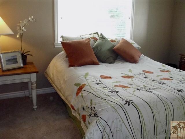 49364 Wayne Street Indio, CA 92201 - Photo 19 of 25 a bed sitting in a bedroom next to a lamp