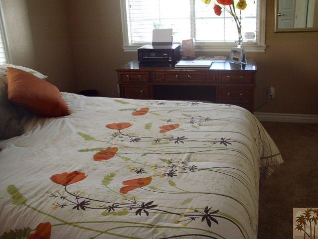 49364 Wayne Street Indio, CA 92201 - Photo 20 of 25 a bedroom with a bed and dresser