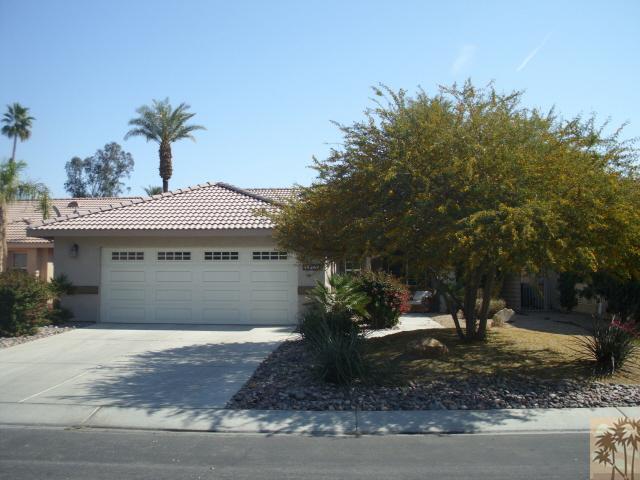 49364 Wayne Street Indio, CA 92201 - Photo 2 of 25 a front view of a house with garden
