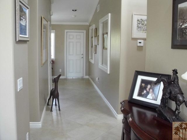 49364 Wayne Street Indio, CA 92201 - Photo 23 of 25 a view of a hallway with paintings on the wall