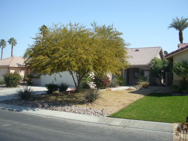 49364 Wayne Street Indio, CA 92201 - Photo 3 of 25 a front view of a house with a yard