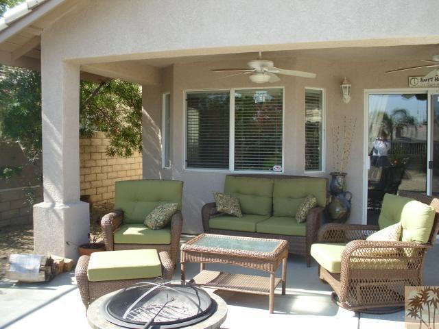 49364 Wayne Street Indio, CA 92201 - Photo 7 of 25 a living room with furniture and a large window