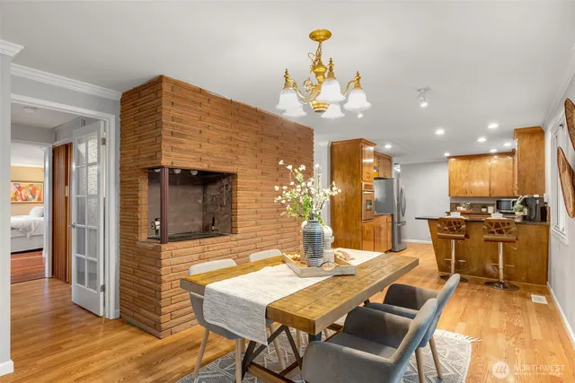 a view of a dining room with furniture window and wooden floor