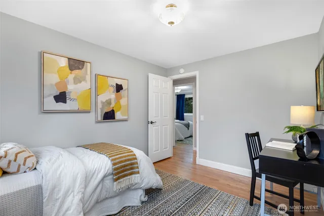 a bedroom with a bed and a table in it