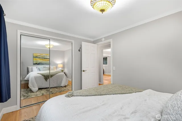 a bedroom with a bed and a couch