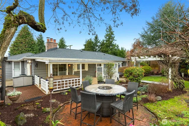 a view of a house with backyard sitting area