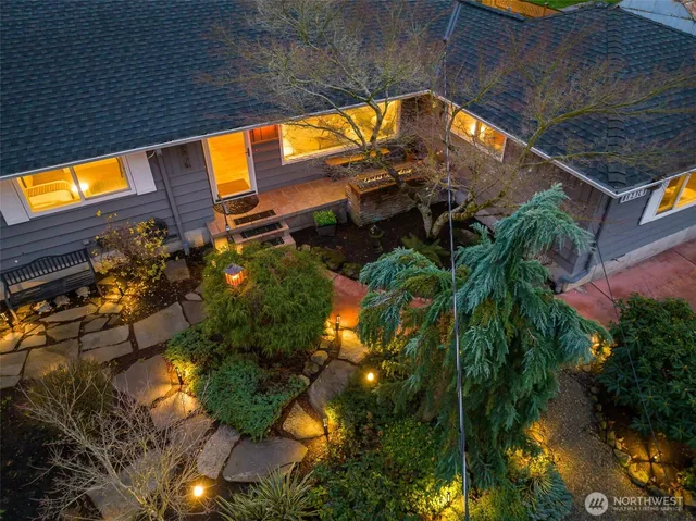 a view of a dry yard with wooden fence