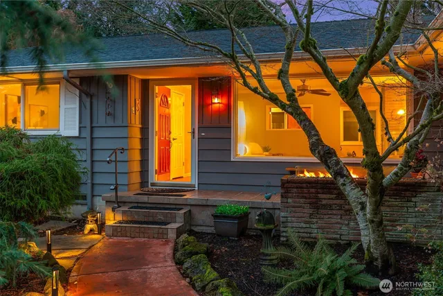 a view of patio with a table and chairs under an umbrella