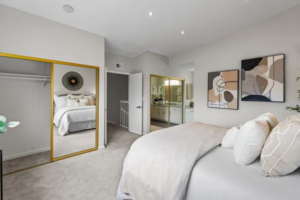 a bedroom with furniture and a window