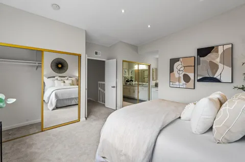 a bedroom with furniture and a window