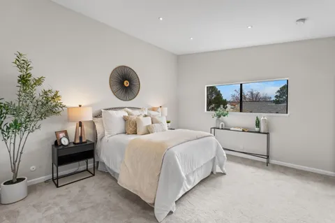 a bedroom with bed and window