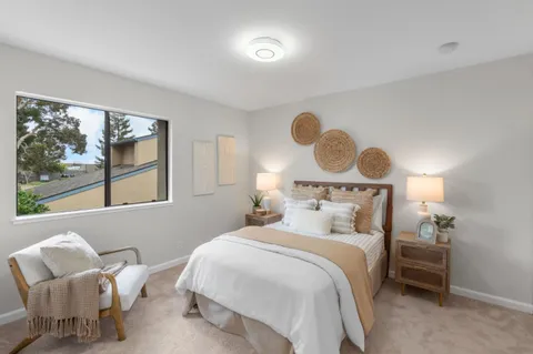 a bedroom with a bed and window