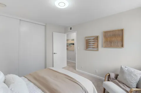 a bedroom with a bed and a couch