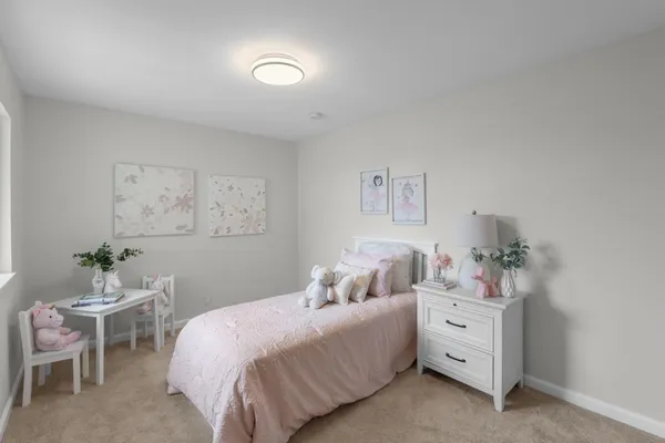 a bedroom with a bed and a couch