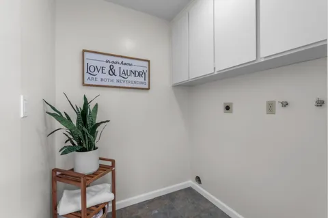 a view of a room with a potted plant on a table