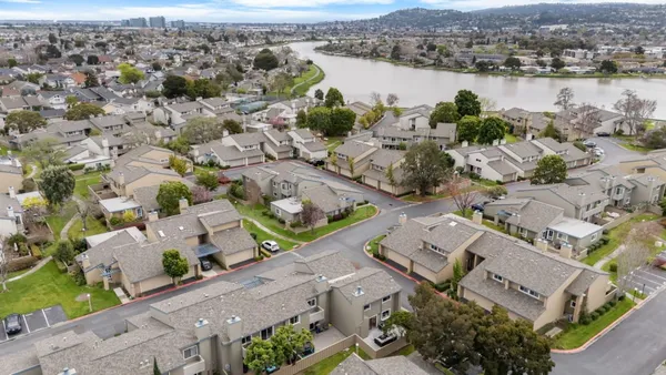 an aerial view of a city with lake view