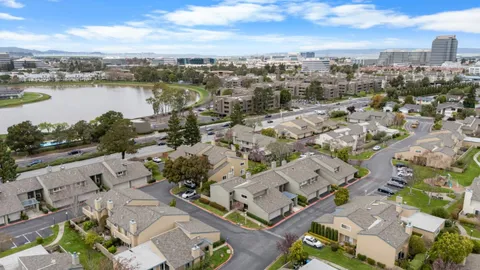 an aerial view of a city with ocean view