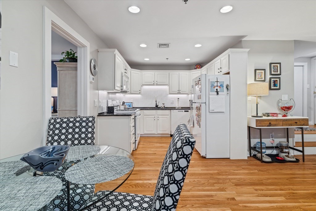 12 Benton Street, Unit 4 Stoneham, MA 02180 - Photo 17 of 35 a living room with furniture and a table