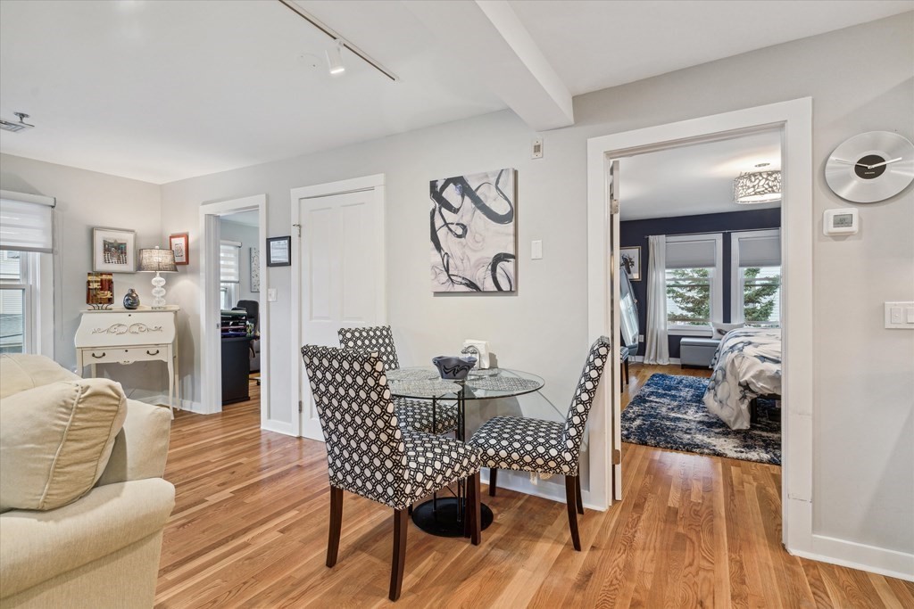 12 Benton Street, Unit 4 Stoneham, MA 02180 - Photo 22 of 35 a living room with furniture and wooden floor