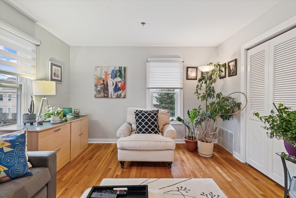 12 Benton Street, Unit 4 Stoneham, MA 02180 - Photo 27 of 35 a living room with furniture potted plant and a window