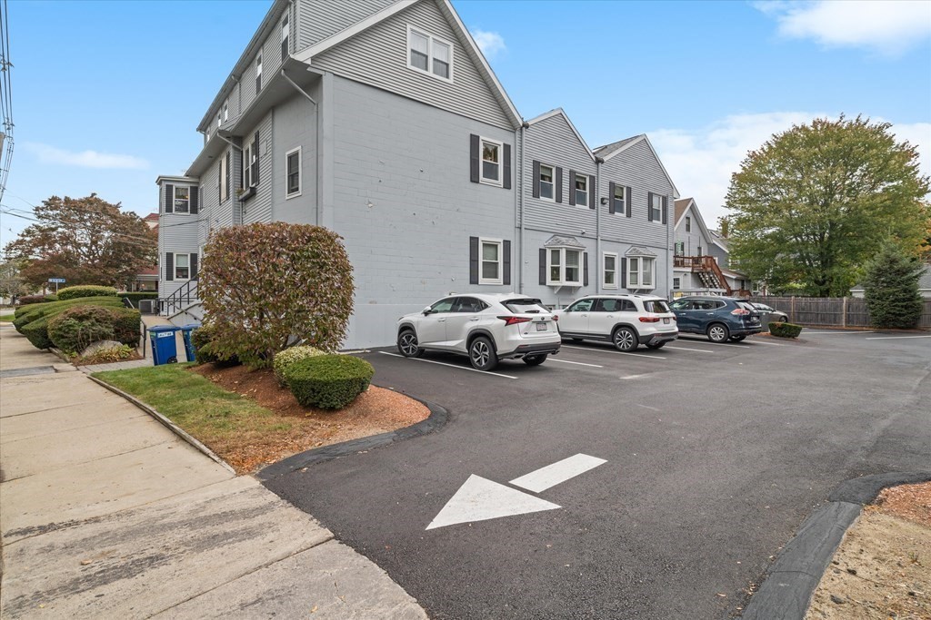 12 Benton Street, Unit 4 Stoneham, MA 02180 - Photo 34 of 35 a cars parked in front of a house