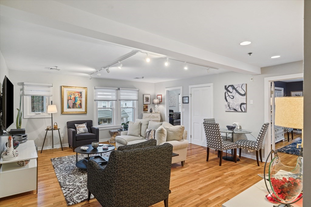 12 Benton Street, Unit 4 Stoneham, MA 02180 - Photo 9 of 35 a living room with furniture and wooden floor