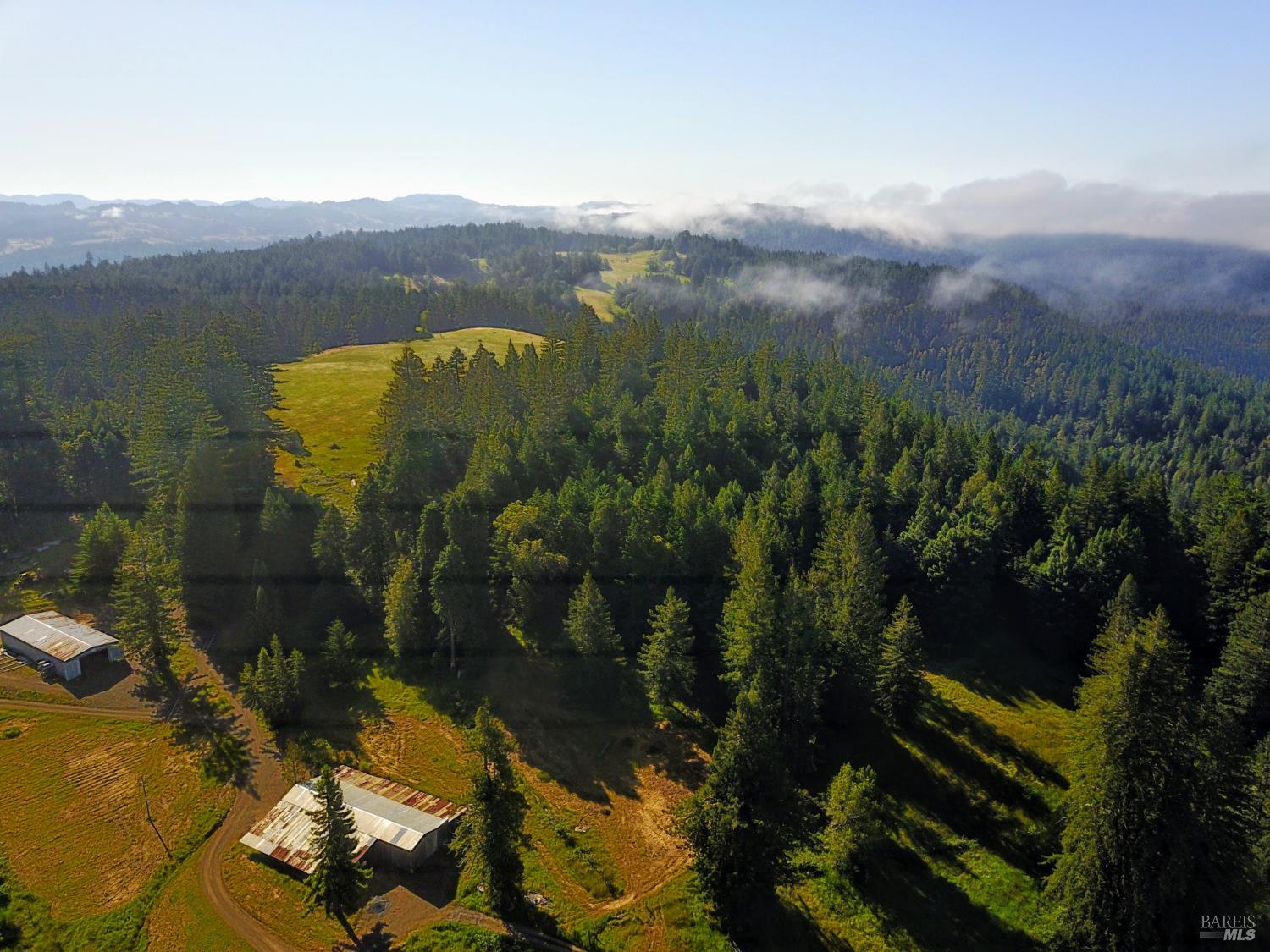 31010 Stewarts Point-skaggs Springs Road Annapolis, CA 95412 - Photo 36 of 78 a view of a lake with a mountain in the background