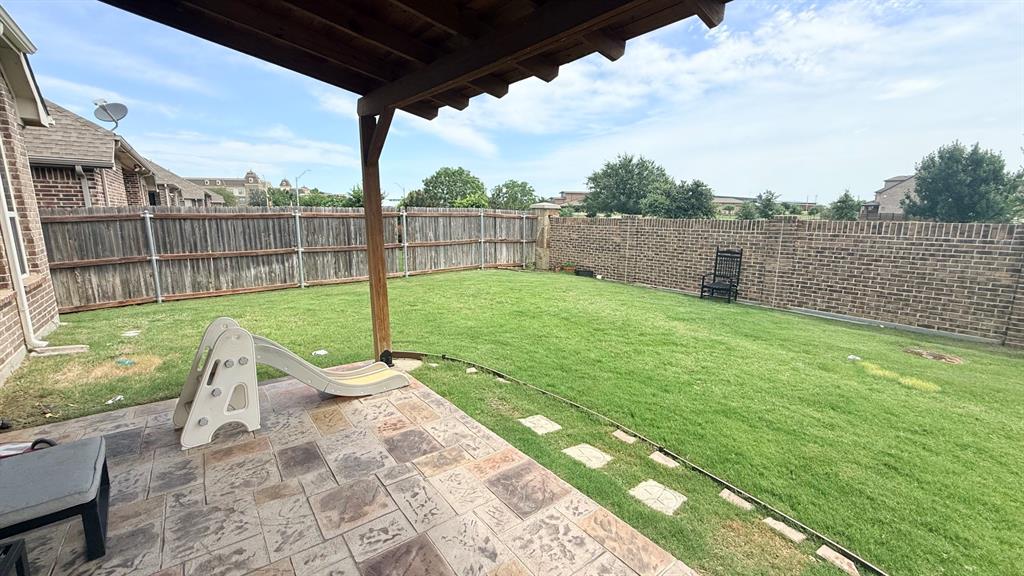 337 Prairie Ridge Lane Lewisville, TX 75056 - Photo 20 of 28 a view of a backyard with wooden floor and fence
