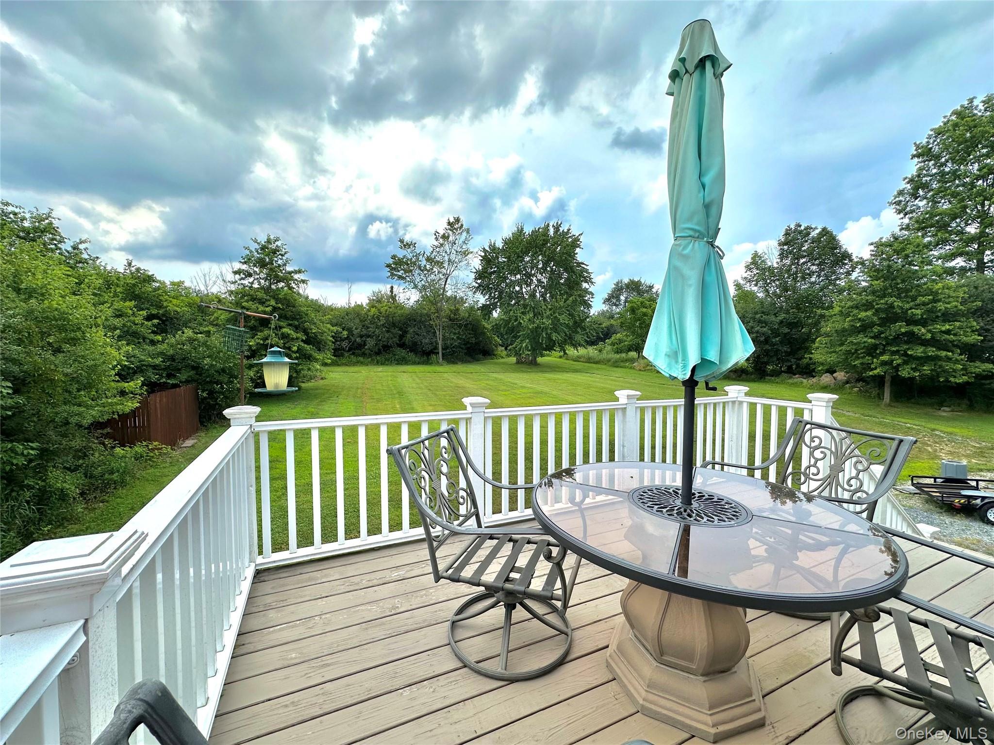 1091 Ridgebury Road New Hampton, NY 10958 - Photo 23 of 27 a view of a balcony with a table and chairs