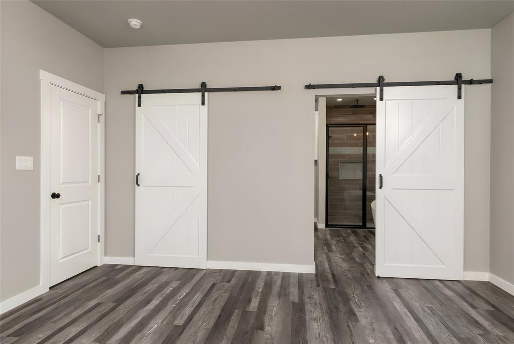 115 Valley Ridge Drive Bridgeport, TX 76426 - Photo 20 of 35 a view of walk in closet with wooden floor