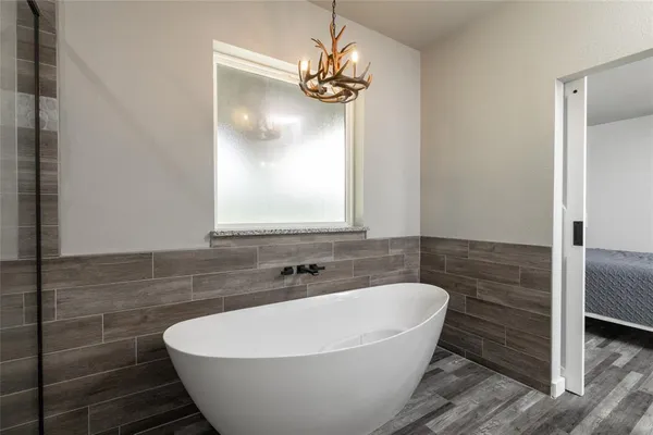 a en suite bathroom with a double vanity sink and a mirror