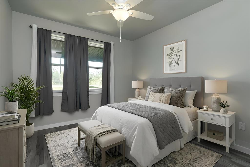 115 Valley Ridge Drive Bridgeport, TX 76426 - Photo 30 of 35 a bedroom with a large bed and a chandelier