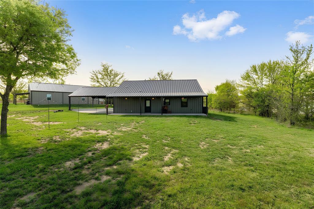 115 Valley Ridge Drive Bridgeport, TX 76426 - Photo 33 of 35 a front view of a house with garden