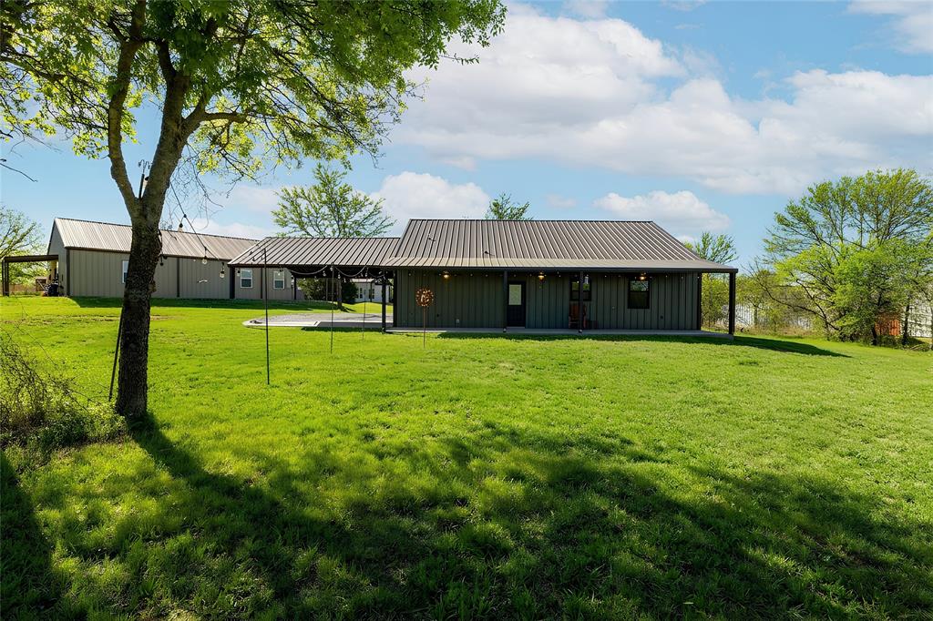 115 Valley Ridge Drive Bridgeport, TX 76426 - Photo 34 of 35 a view of a house with a yard