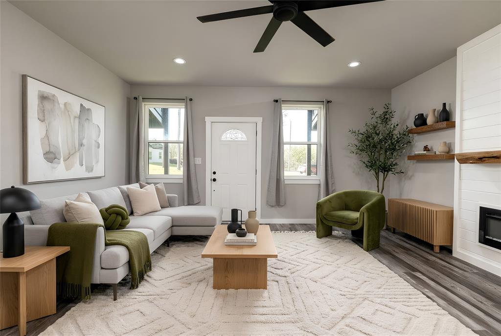 115 Valley Ridge Drive Bridgeport, TX 76426 - Photo 8 of 35 a living room with furniture and a potted plant
