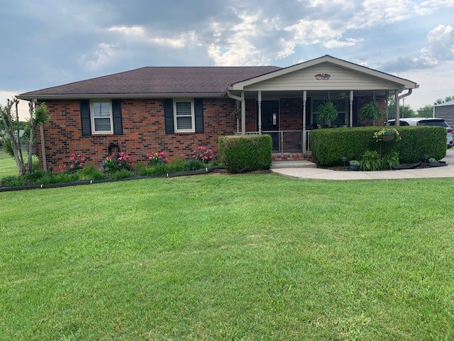 3078 Big Springs Road Lebanon, TN 37090 - Photo 1 of 24 a front view of a house with a garden
