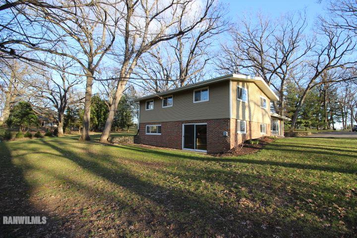 986 West Angle Road Freeport, IL 61032 - Photo 3 of 16 a front view of house with yard and trees