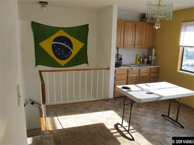 1395 Kings Row Reno, NV 89503 - Photo 4 of 6 a table with chairs and painting on the wall