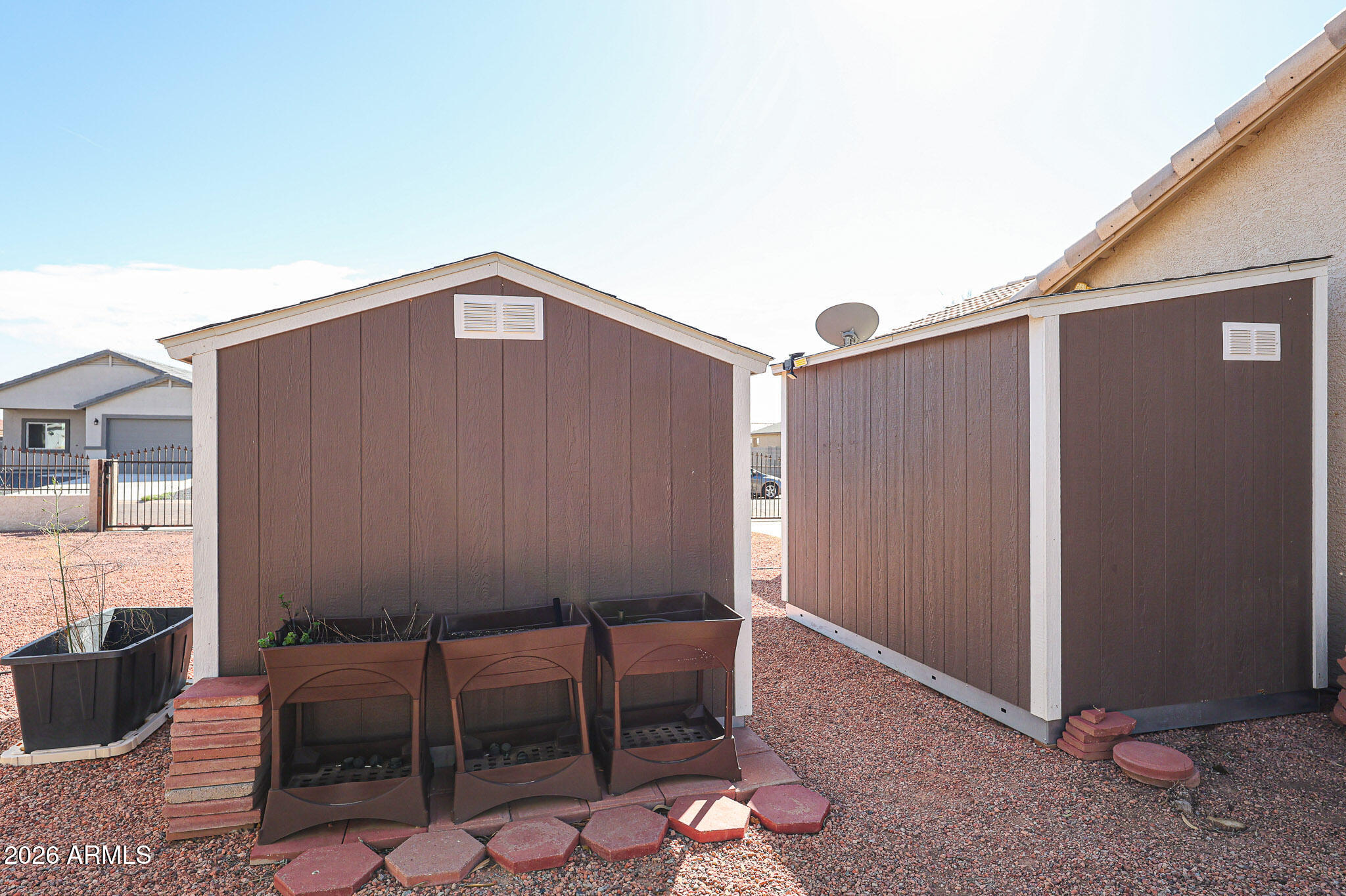 14980 South Capistrano Road Arizona City, AZ 85123 - Photo 36 of 39 a backyard of a house with table and chairs