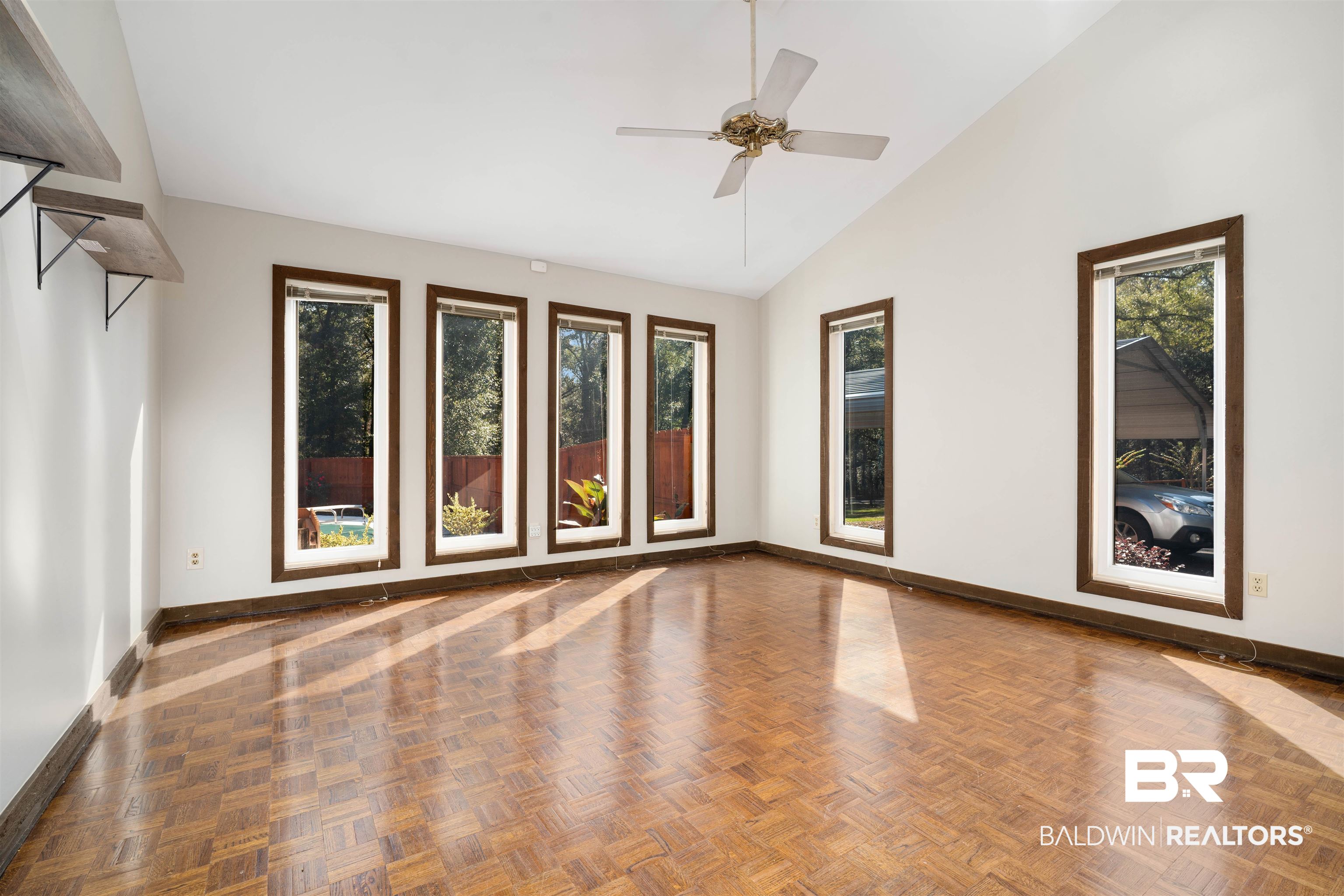 7912 Yorkhaven Road Mobile, AL 36695 - Photo 15 of 41 Spare room featuring ceiling fan and high vaulted ceiling