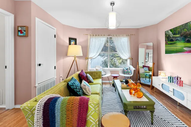 a living room filled with furniture and a chandelier