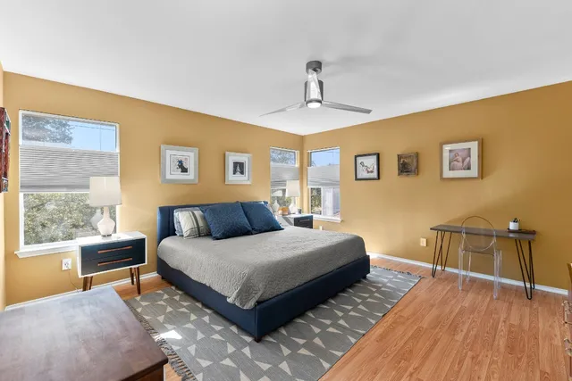 a bedroom with a bed and a couch